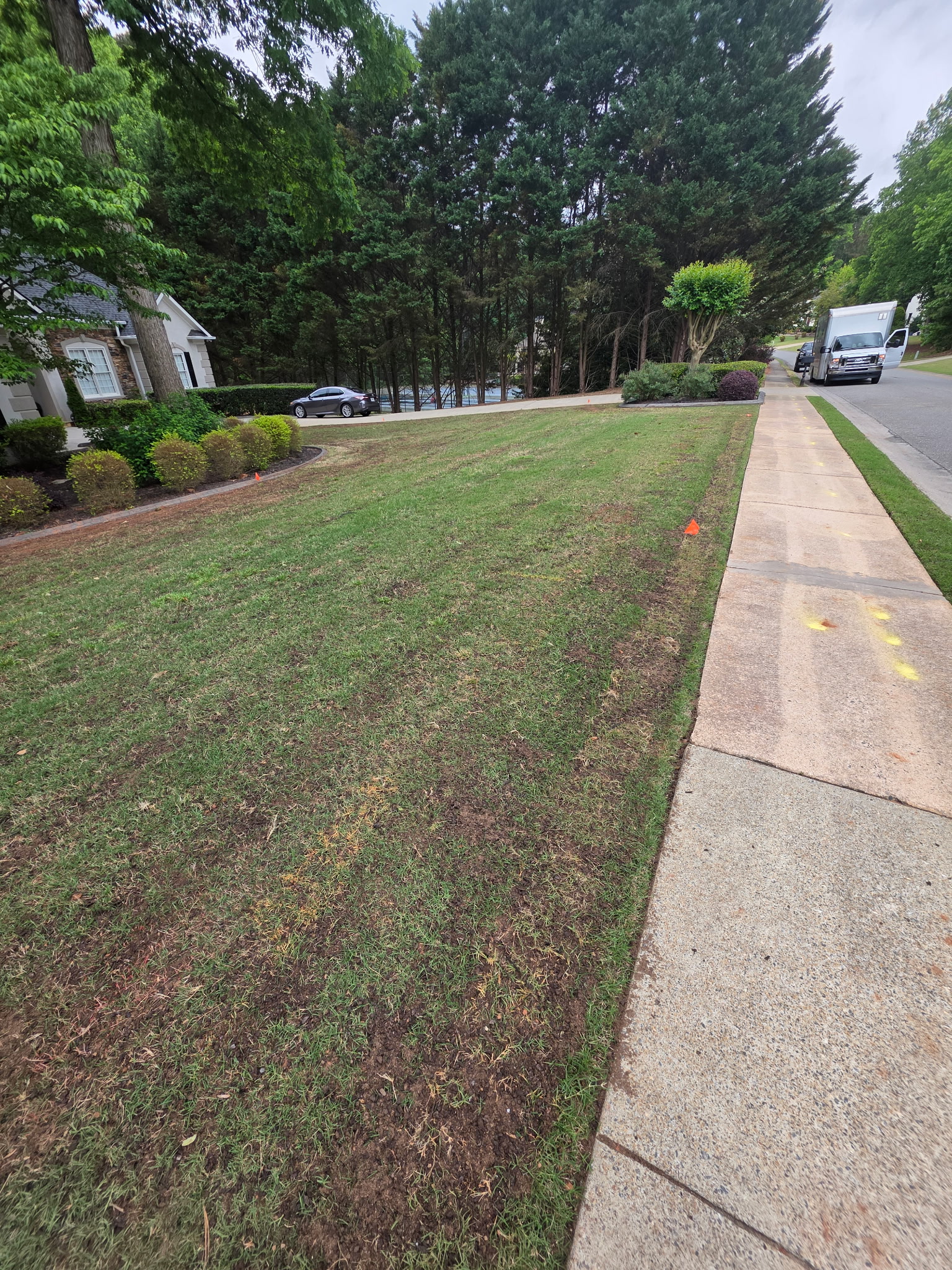 Residential lawn prepared for service with utility markings
