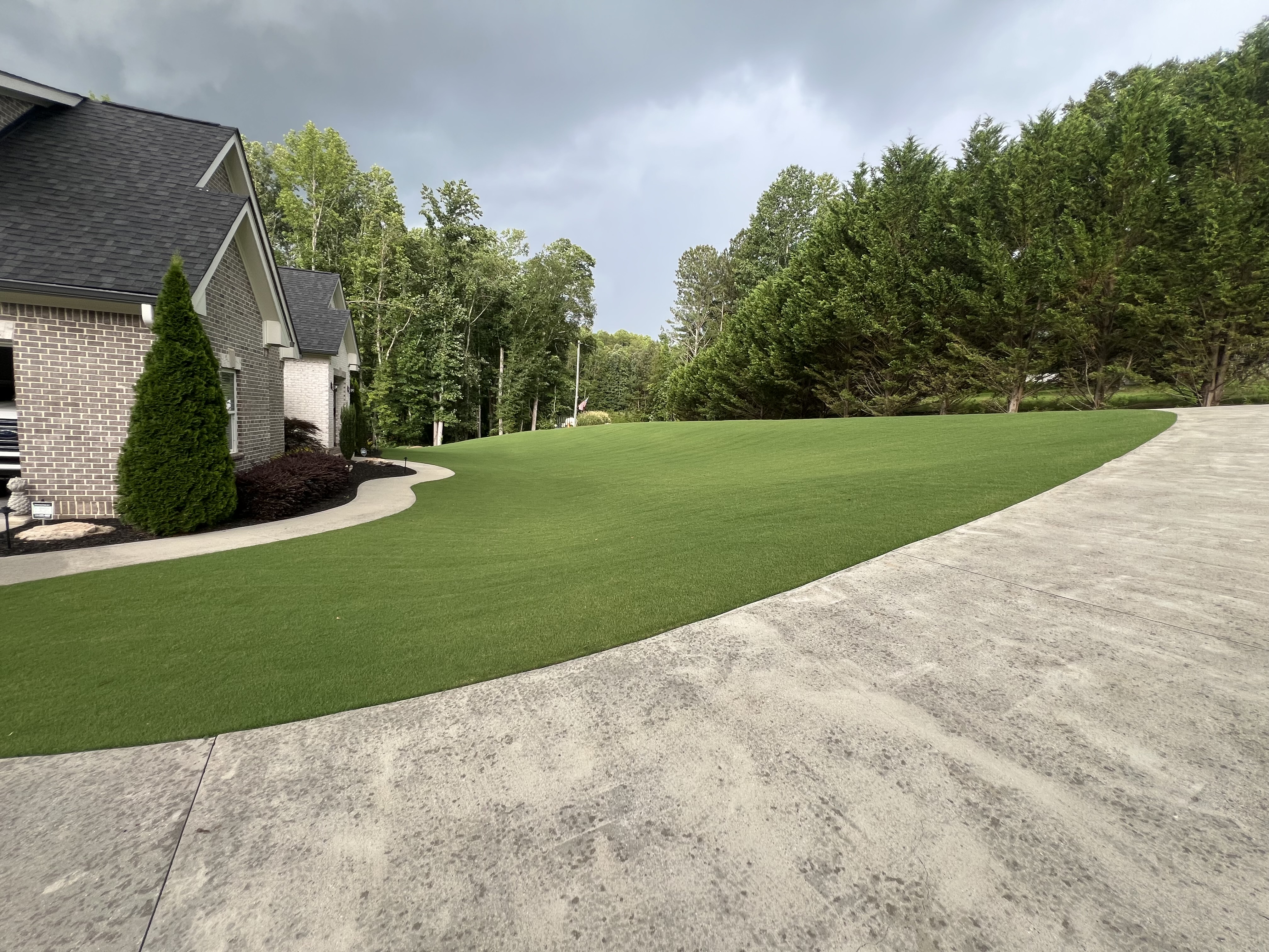 Lush manicured lawn with clean hardscape edges
